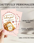 a hand holding a personalized cutie pie-themed card. The card has a pink and white striped background and includes a question about the cutie pie, a winner's circle, and a funny winning and losing reminder. The card is described as beautifully personalized and customized for the recipient, suggesting it has been tailored to their preferences.