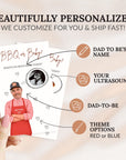 a hand holding a personalized BBQ or baby announcement card. The card includes a photo of a man wearing a red and white checkered apron, along with various icons representing different elements of the announcement, such as the dad-to-be name, ultrasound, and theme options.