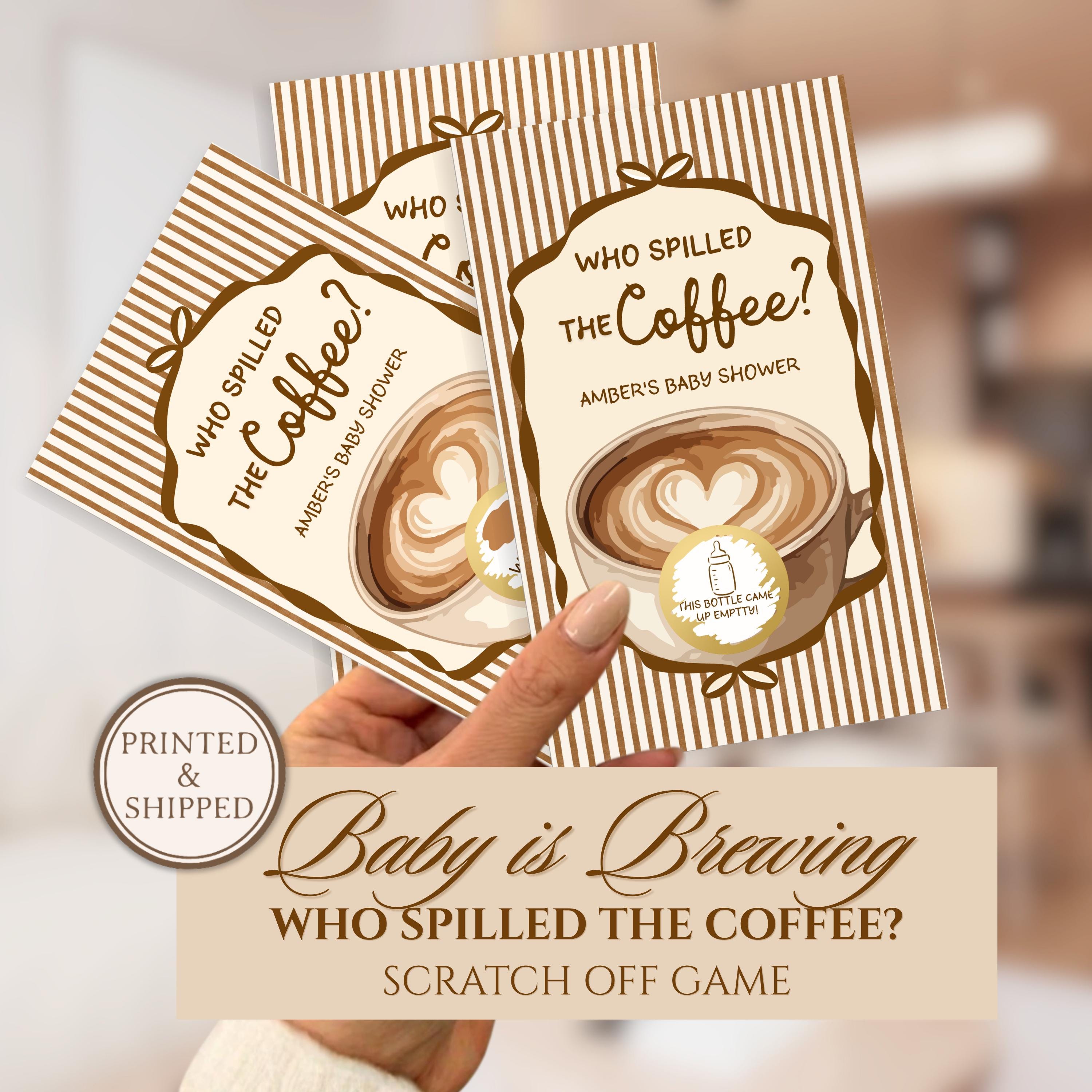 A hand holding three printed coffee-themed baby shower invitations, with the text "Who Spilled the Coffee?" and "Baby is Braving" printed on them.
