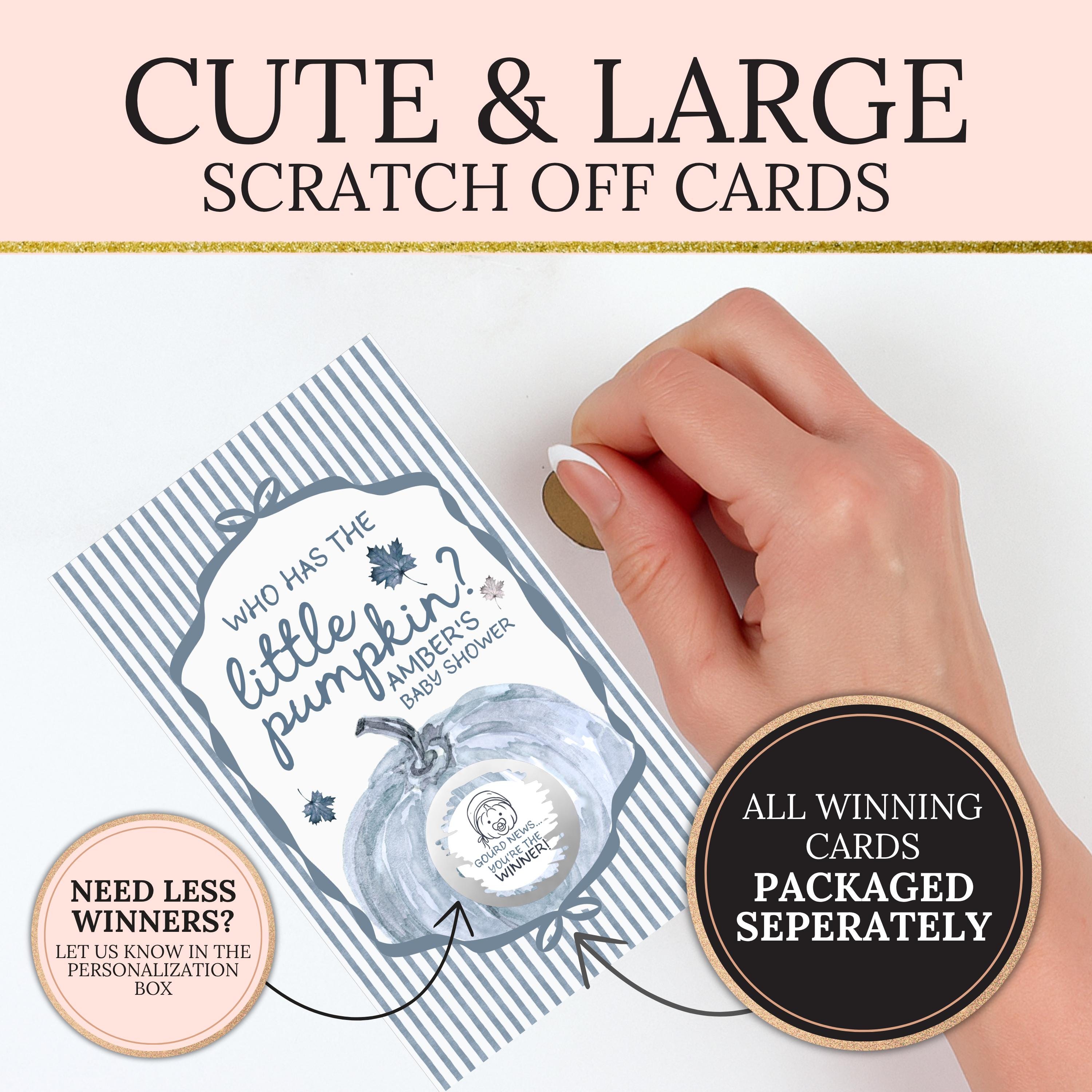 a hand holding a large scratch-off card with a pumpkin design, and there is a smaller sign next to it that says "Needless Winners? Let us know in the Personalization Box".