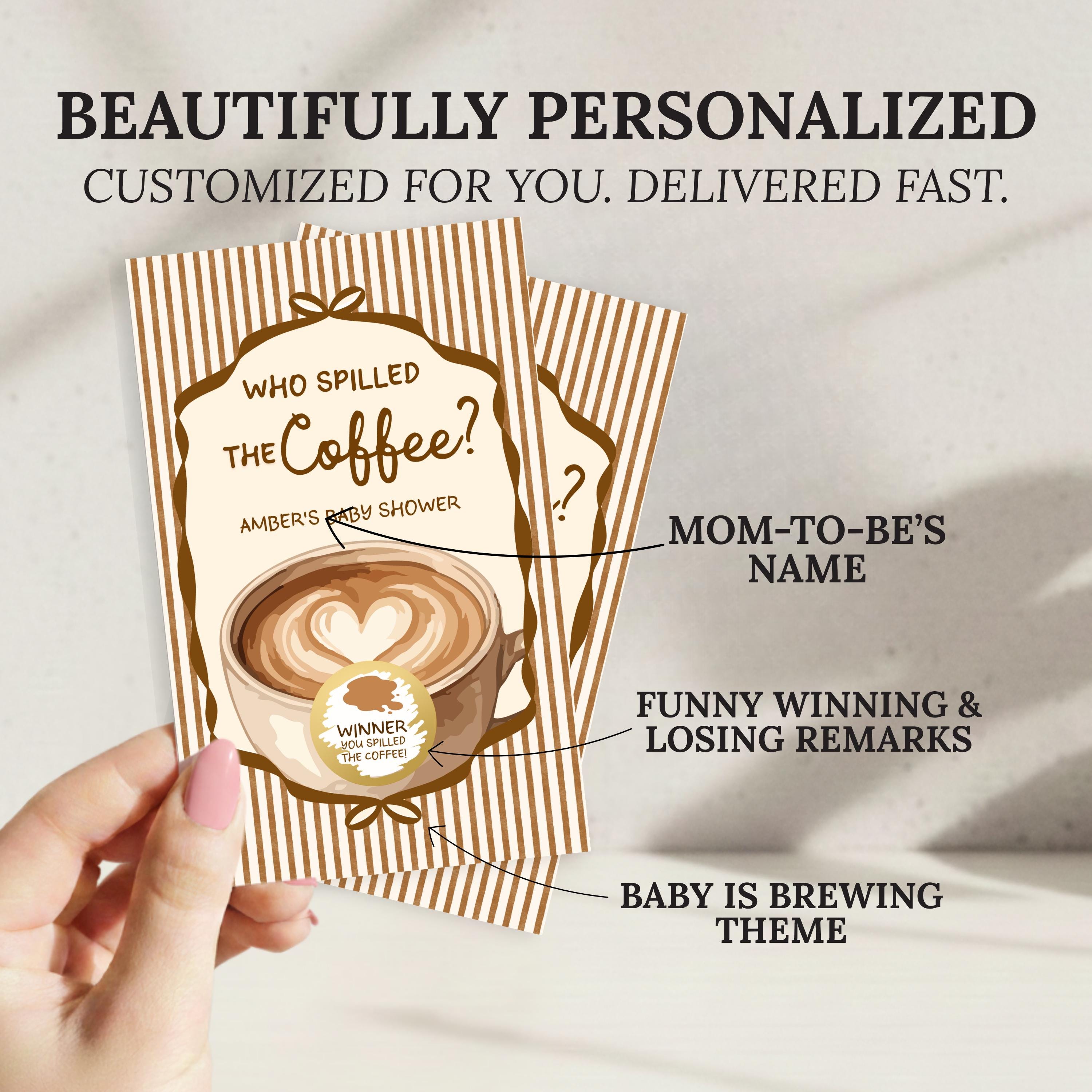 a hand holding a personalized coffee-themed baby shower card. The card has a coffee cup design and includes text that reads "Who spilled the coffee?" and "AMBER'S BABY SHOWER". The card also includes text that says "MOM-TO-BE'S NAME", "FUNNY WINNING & LOSING REMARKS", and "BABY IS BREWING THEME".