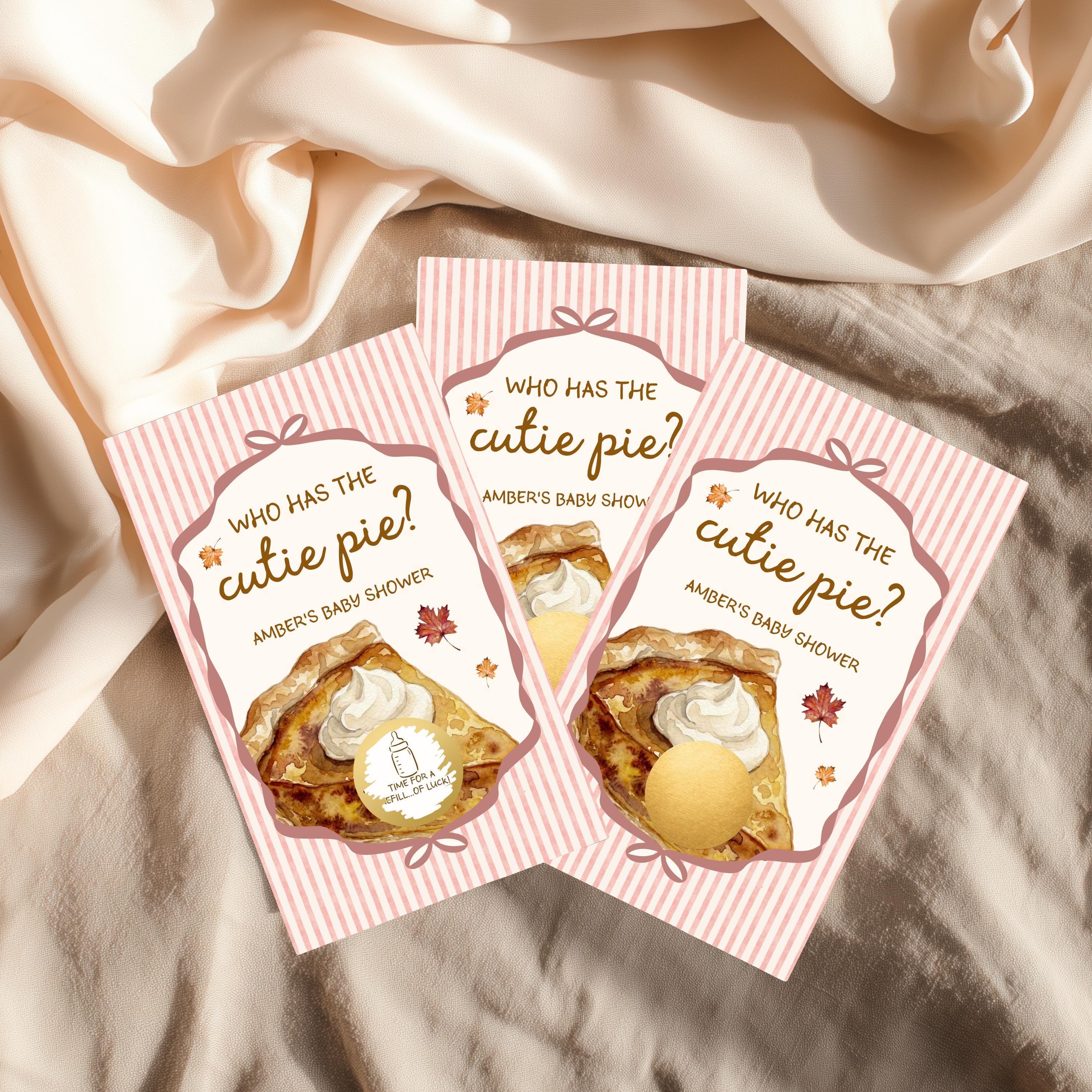 Three pink and white baby shower invitations with illustrations of pies and the text "Who has the cute pie?"