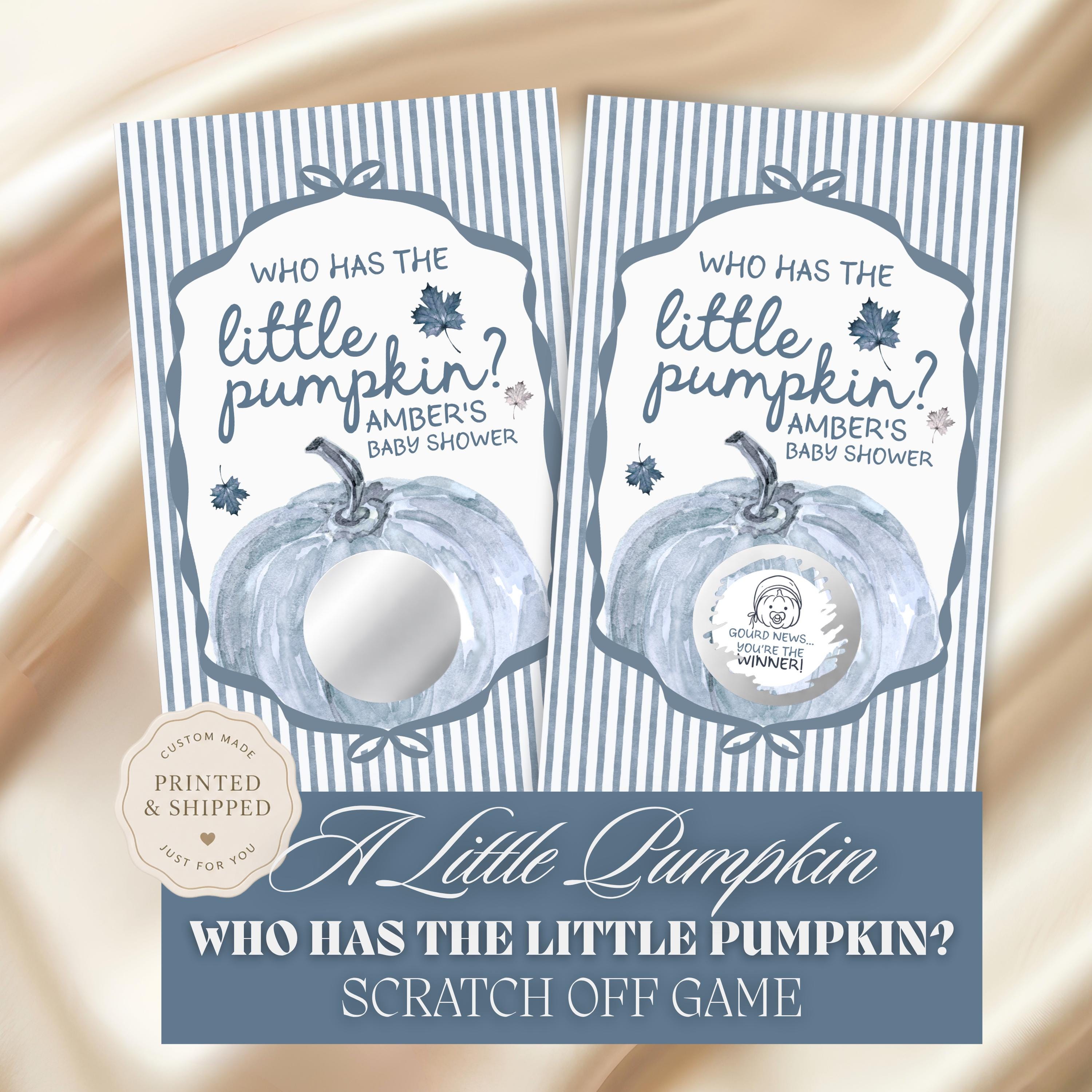 The image is a printed baby shower invitation featuring a pumpkin theme. The invitation has a blue and white striped background with a central image of a pumpkin and text asking "Who has the little pumpkin?". The invitation is accompanied by a "Custom Made" stamp and a "Printed Shipped" stamp, indicating that it has been printed and shipped. The invitation also includes a game called "Scratch Off Game" that asks "Who has the little pumpkin?".