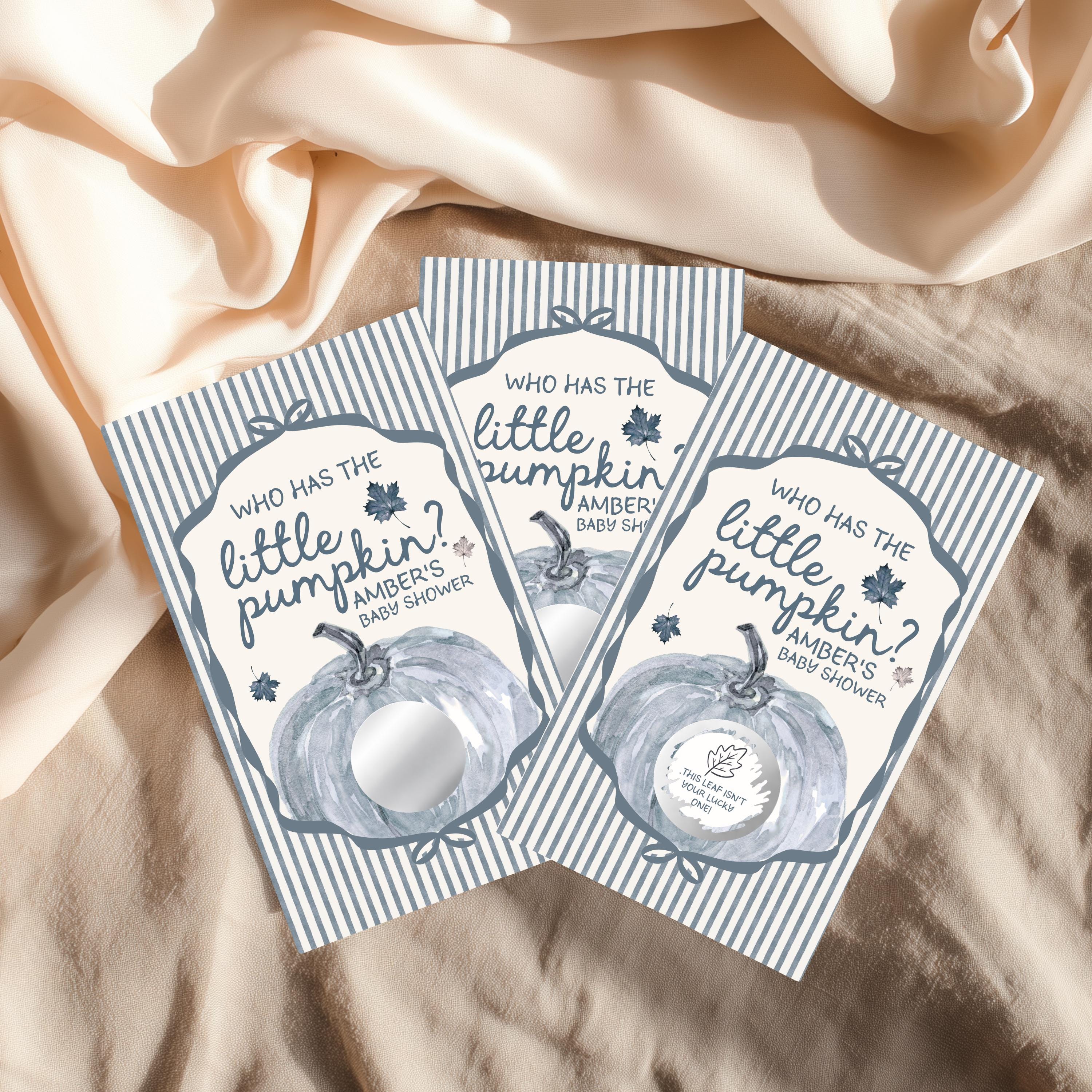 Three identical cards with a pumpkin design and text, placed on a beige fabric background.