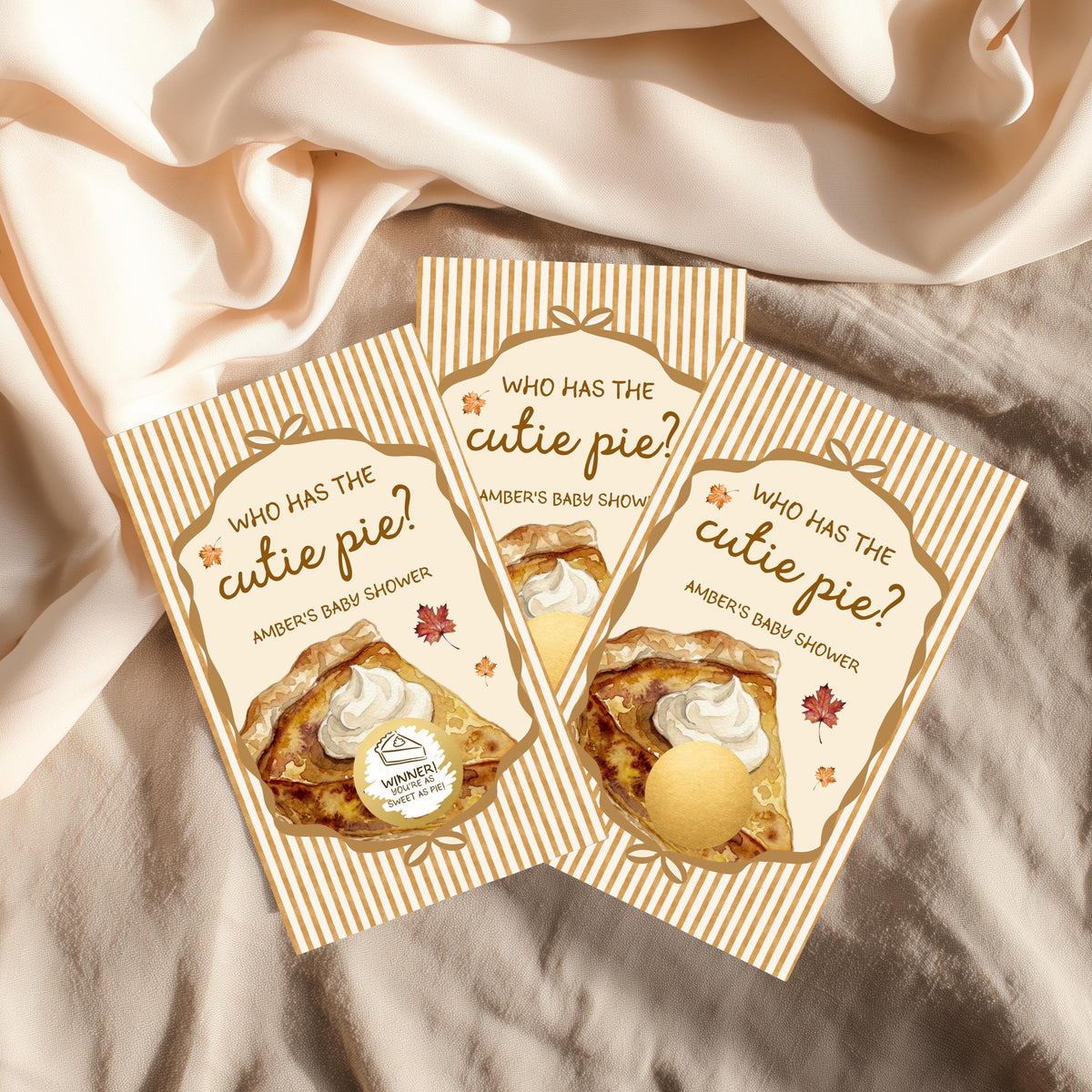 Three identical baby shower invitations with a pie design and the text "Who has the cute pie?" printed on them.