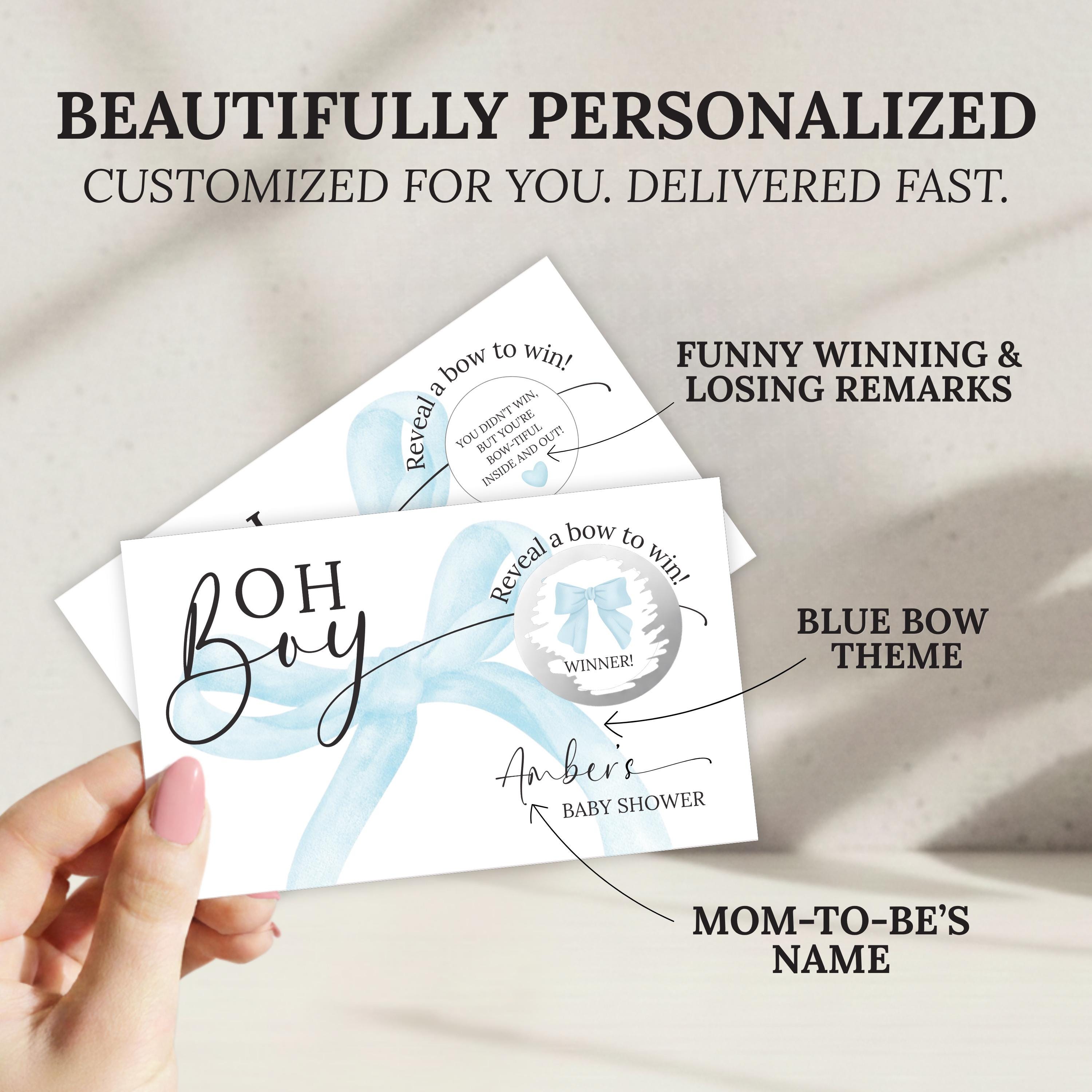 The image is a hand holding a personalized baby shower invitation card. The card features a blue bow theme and includes a humorous message about winning a blue bow. The card is described as " Beautifully Personalized" and "Customized for you, delivered fast." The card also includes a "Funny Winning & Losing Remarks" and a "Blue Bow Theme" detail. The card is labeled "Mom-to-Be's Name" and "Reveal a bow to win!" The card is described as a "Blue Bow" and "Baby shower" themed card.