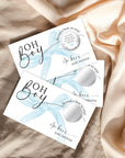three pieces of paper with text and graphics related to a baby shower.