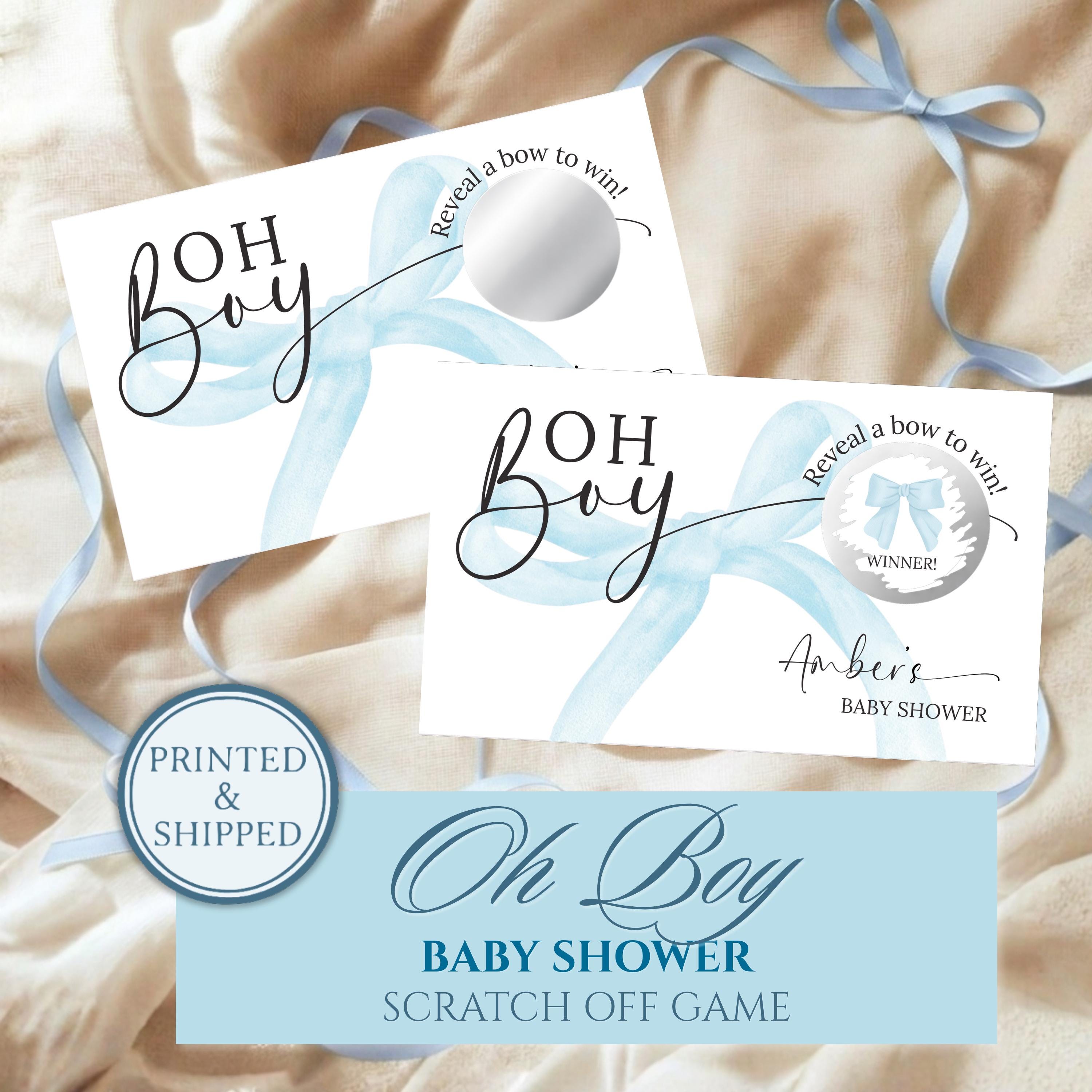 The image is a printed and shipped baby shower invitation with a blue ribbon and a bow. The invitation features the text "OH BOY BABY SHOWER SCRATCH OFF GAME" and includes a "WINNER!" sign.