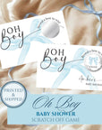 The image is a printed and shipped baby shower invitation with a blue ribbon and a bow. The invitation features the text "OH BOY BABY SHOWER SCRATCH OFF GAME" and includes a "WINNER!" sign.